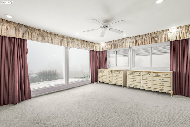 unfurnished bedroom with carpet flooring and ceiling fan