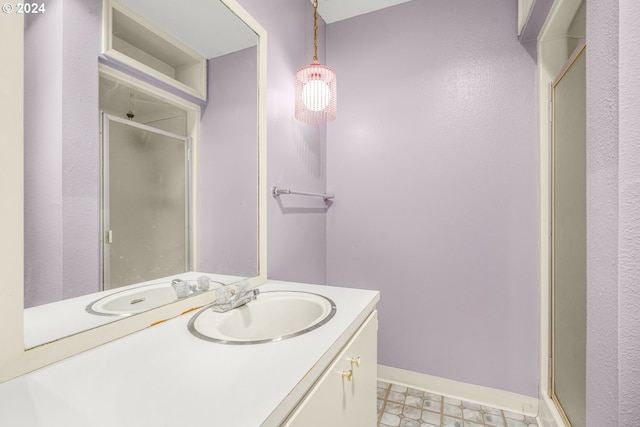 bathroom with vanity and an enclosed shower