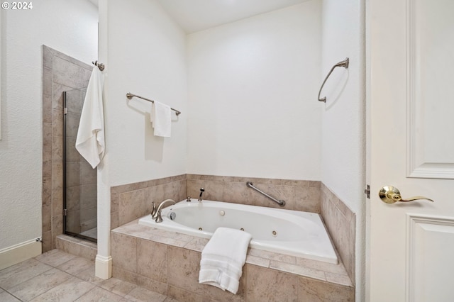 full bathroom with a stall shower and a whirlpool tub