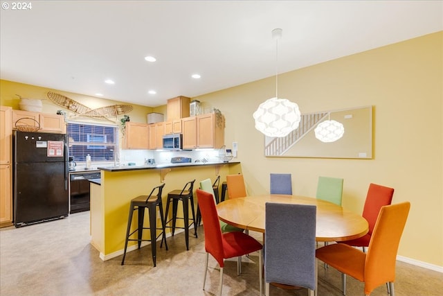 view of carpeted dining area