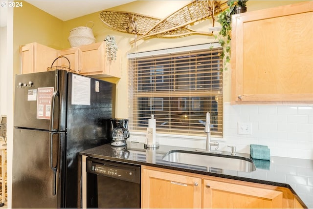 kitchen with light brown cabinetry, black dishwasher, fridge, and sink