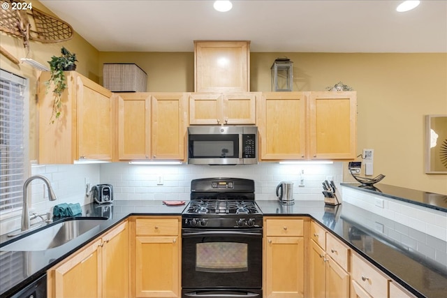 kitchen with decorative backsplash, appliances with stainless steel finishes, light brown cabinetry, and sink