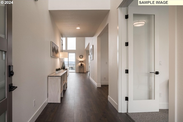 hallway featuring dark hardwood / wood-style floors