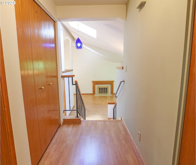 3794 Wilshire Ln, Eugene, OR 97405 - hall with an upstairs landing, a skylight, light wood finished floors, lofted ceiling, and baseboards