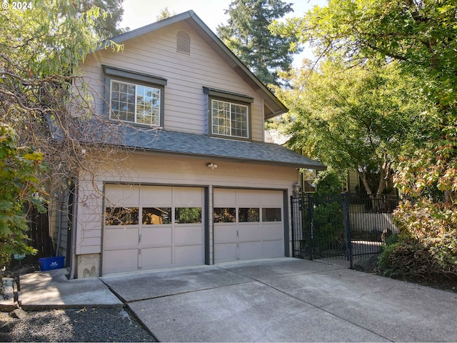 3794 Wilshire Ln, Eugene, OR 97405 - garage featuring concrete driveway and fence