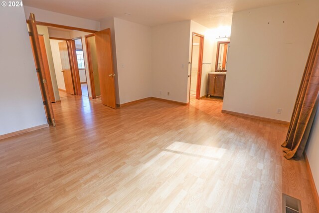 unfurnished room featuring light hardwood / wood-style floors