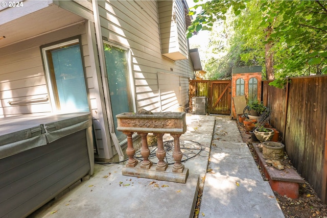 3794 Wilshire Ln, Eugene, OR 97405 - fenced backyard with a patio, a hot tub, and a gate