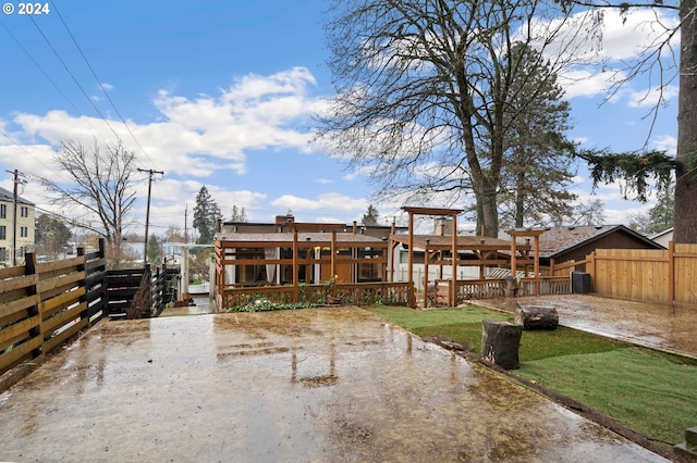 rear view of property featuring a yard