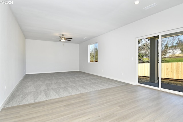 unfurnished room featuring ceiling fan and light hardwood / wood-style floors