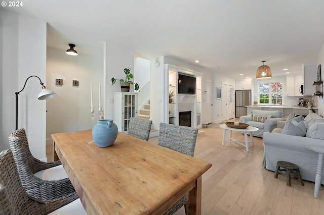 dining room with light hardwood / wood-style flooring