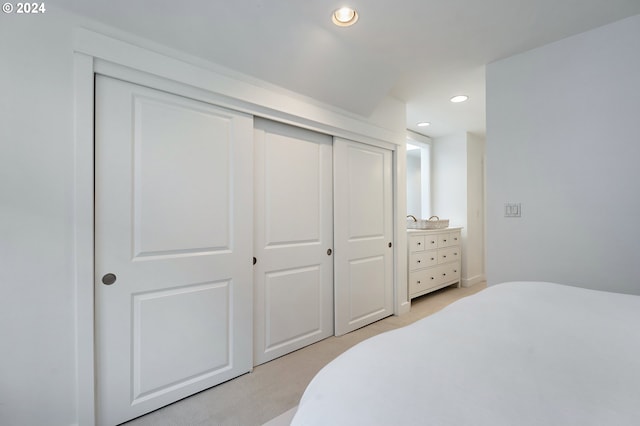 carpeted bedroom featuring a closet