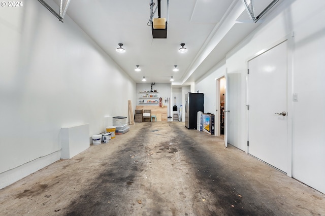 garage featuring stainless steel refrigerator