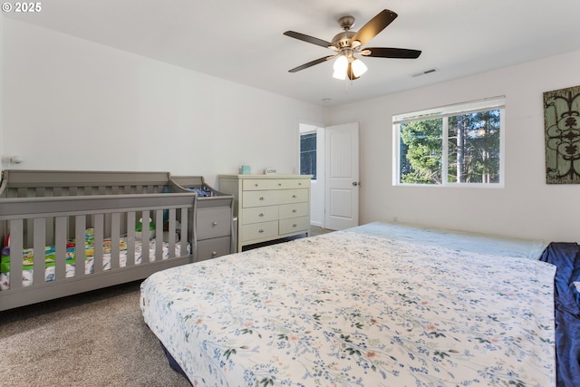 bedroom with ceiling fan and carpet floors