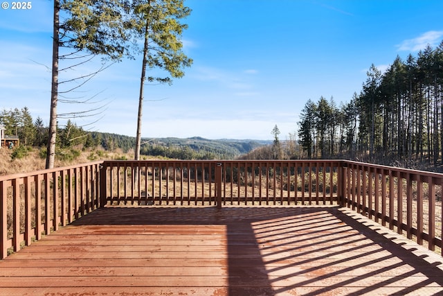 wooden deck with a mountain view