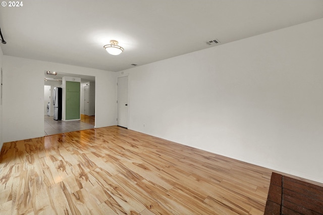 unfurnished room featuring light hardwood / wood-style flooring