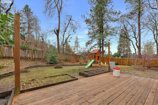 wooden deck featuring a playground