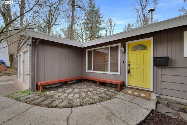 property entrance with a garage