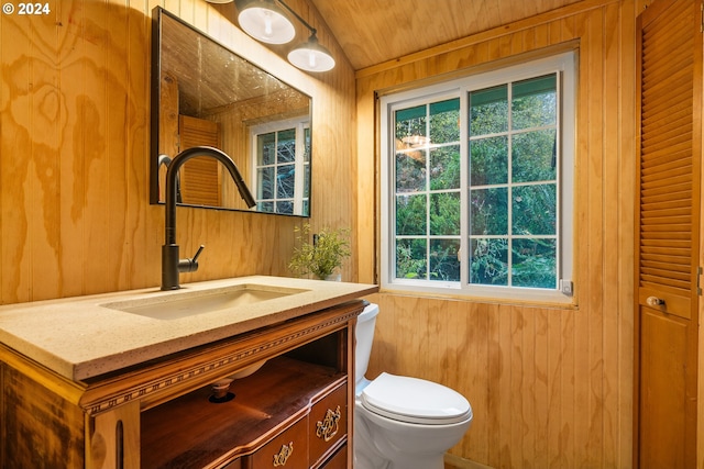 bathroom featuring vanity, wooden ceiling, toilet, lofted ceiling, and wood walls