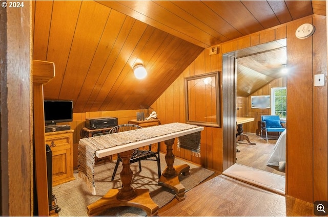 home office featuring wood walls, light wood-type flooring, wood ceiling, and vaulted ceiling