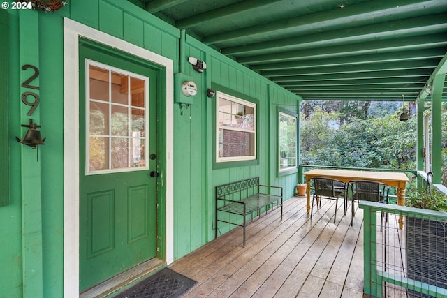 view of exterior entry featuring a porch