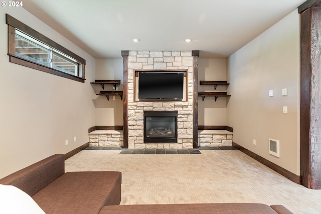 carpeted living room featuring a fireplace