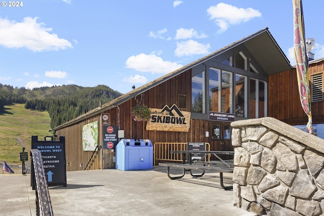 view of property exterior with a mountain view