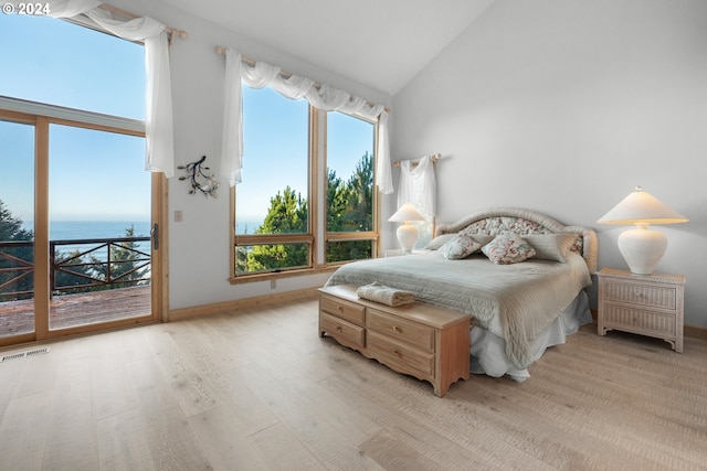 79274 Ray Brown Rd, Arch Cape, OR 97102 - bedroom with access to outside, light hardwood / wood-style flooring, a water view, and high vaulted ceiling