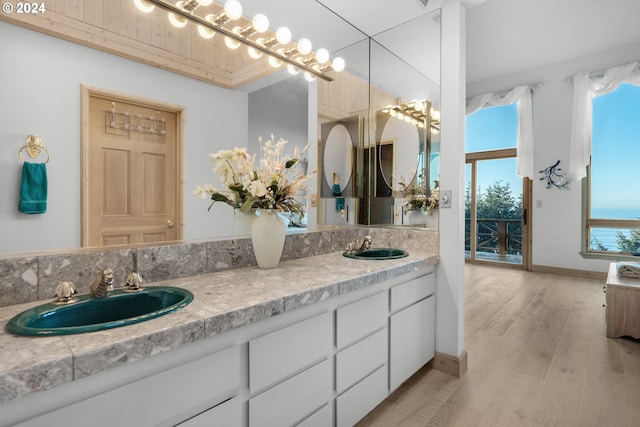 79274 Ray Brown Rd, Arch Cape, OR 97102 - bathroom with hardwood / wood-style floors and vanity
