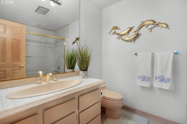 79274 Ray Brown Rd, Arch Cape, OR 97102 - bathroom with tile patterned floors, toilet, an enclosed shower, and vanity