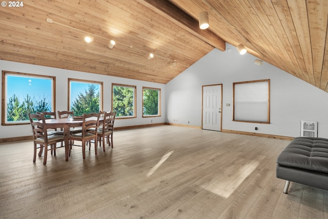 79274 Ray Brown Rd, Arch Cape, OR 97102 - dining space with high vaulted ceiling, beamed ceiling, heating unit, wood ceiling, and light wood-type flooring