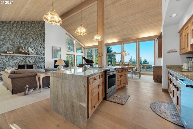 79274 Ray Brown Rd, Arch Cape, OR 97102 - kitchen with stainless steel range with electric stovetop, wood ceiling, pendant lighting, a fireplace, and light hardwood / wood-style floors