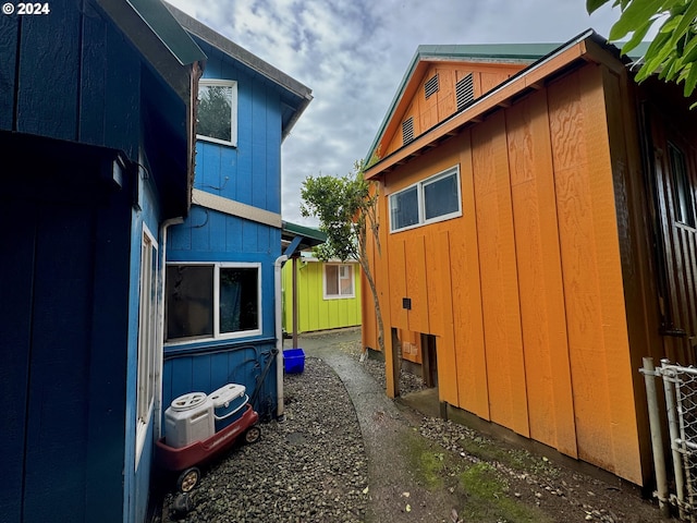 view of side of home featuring central AC