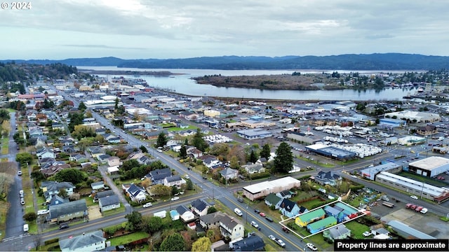 bird's eye view featuring a water and mountain view