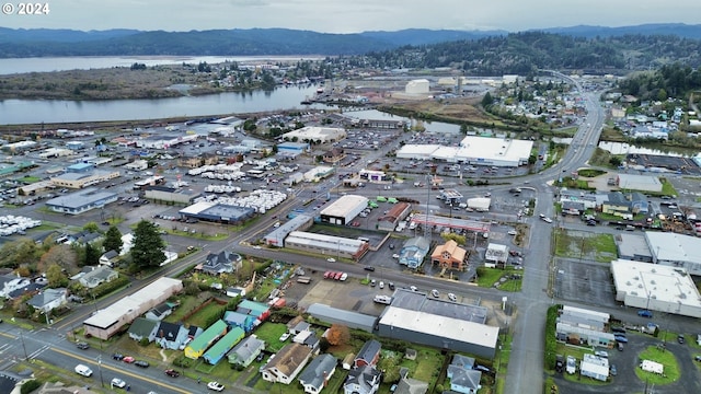 aerial view featuring a water and mountain view