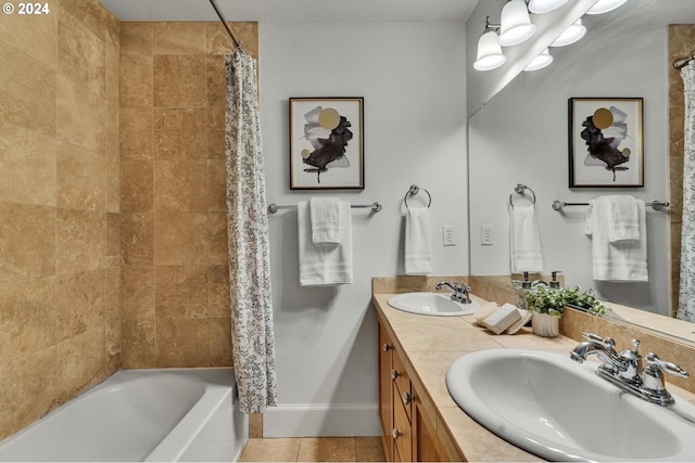 bathroom with vanity, tile patterned floors, and shower / bath combo with shower curtain