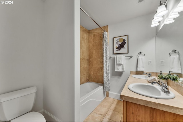 full bathroom featuring toilet, vanity, tile patterned floors, and shower / tub combo