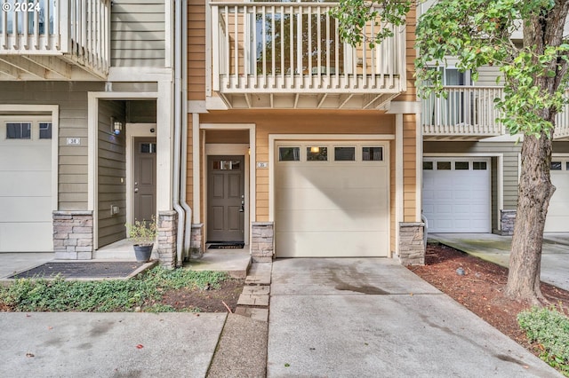 exterior space featuring a balcony and a garage