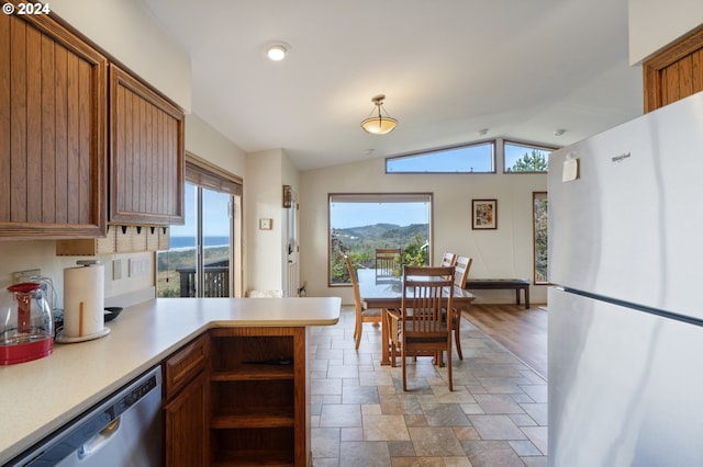 kitchen with a mountain view, stainless steel appliances, and plenty of natural light