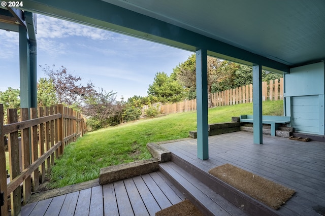 wooden deck with a yard