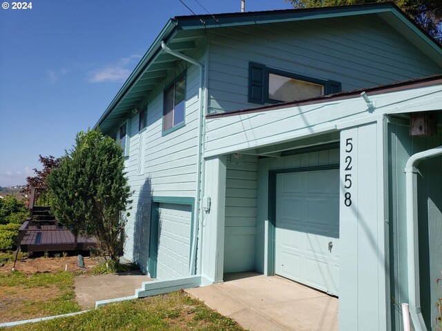 view of side of property featuring a garage