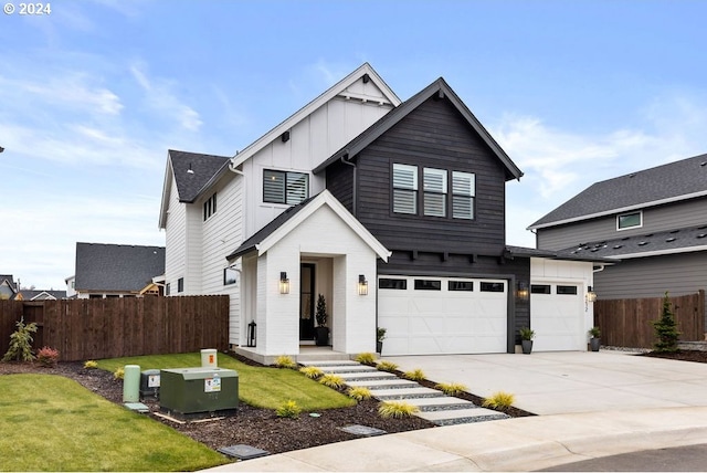 modern inspired farmhouse with a garage and a front yard