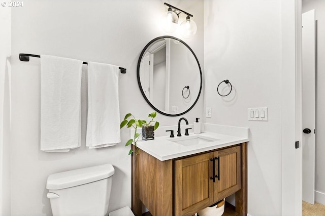 bathroom with oversized vanity and toilet