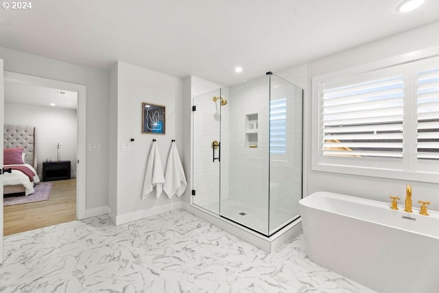 bathroom with tile flooring and independent shower and bath