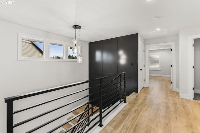 hall with light wood-type flooring