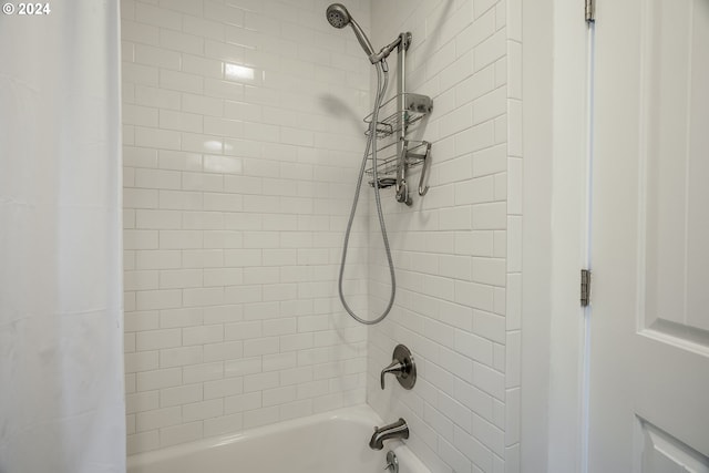 bathroom featuring shower / tub combo with curtain