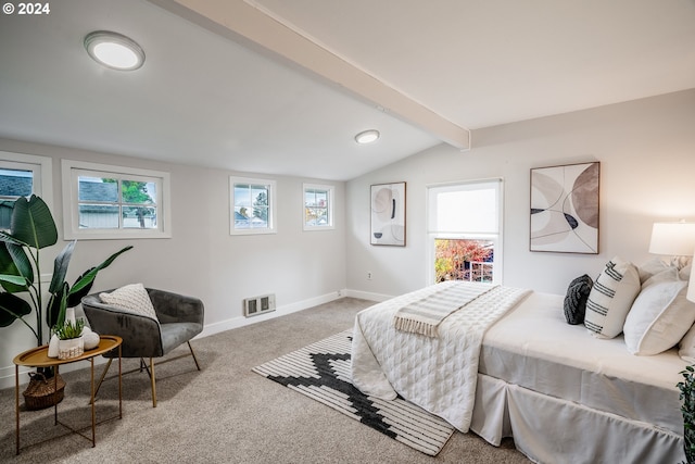 carpeted bedroom with multiple windows and lofted ceiling with beams