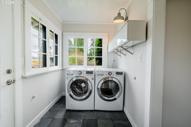 washroom featuring wooden ceiling, crown molding, and washing machine and clothes dryer