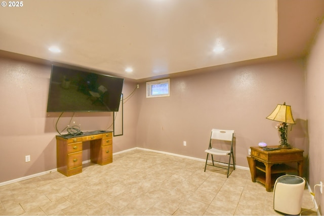 living area with recessed lighting and baseboards