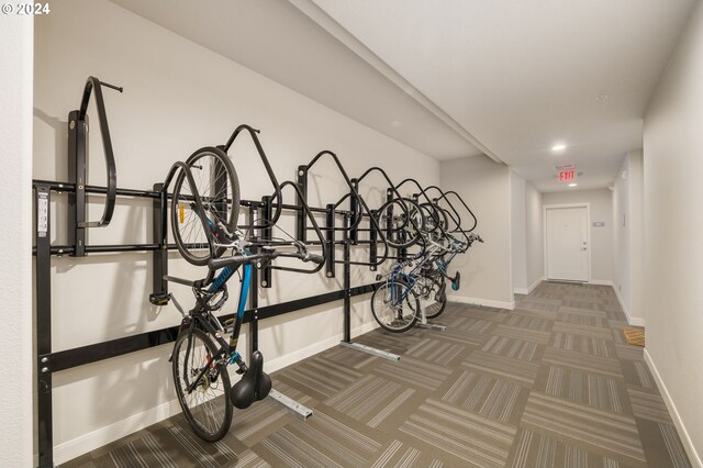 interior space featuring bike storage and baseboards