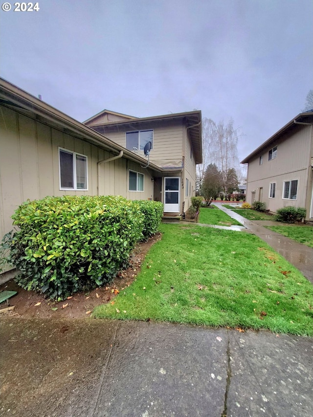 view of home's exterior with a yard